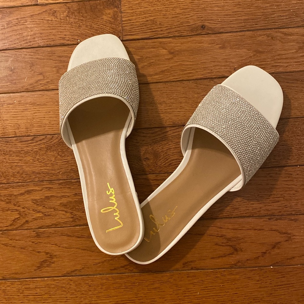 Lulu’s white rhinestone slides